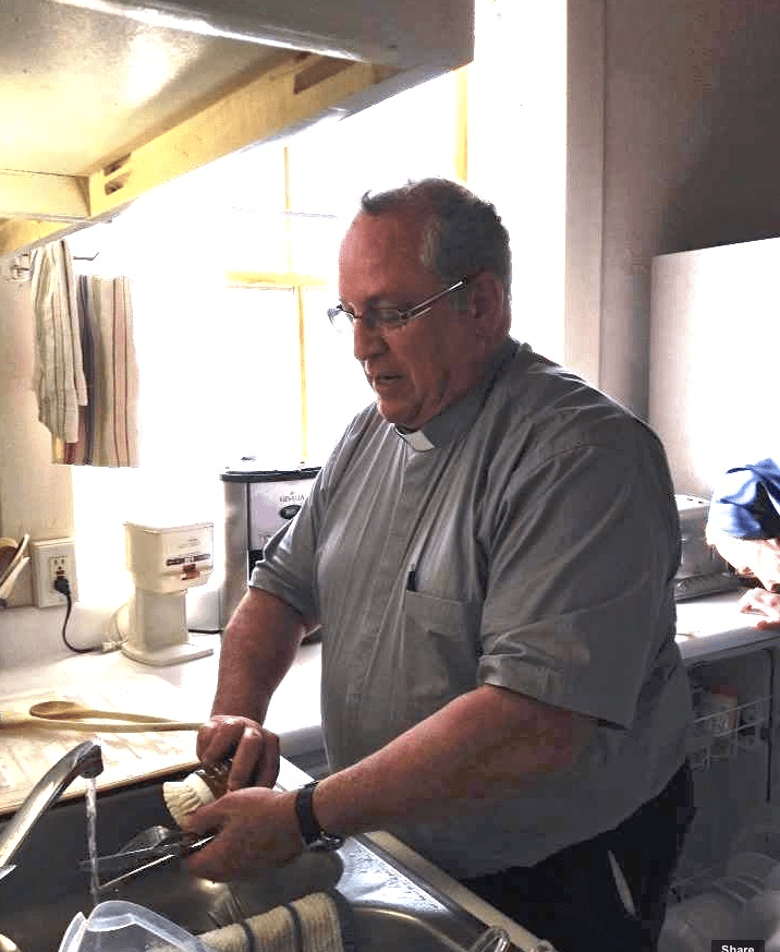 Superior General washes dishes